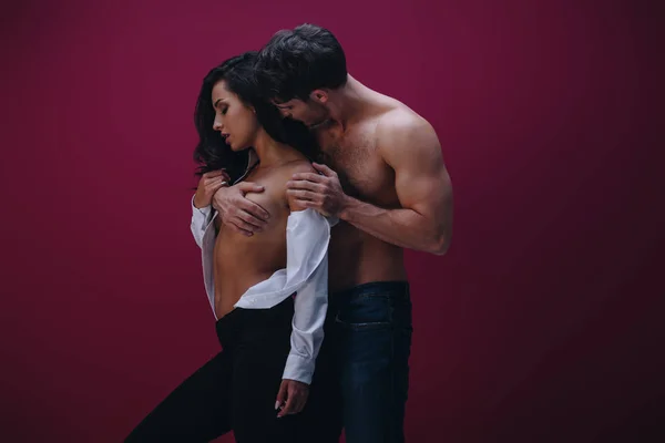 Adult couple sharing an intimate embrace